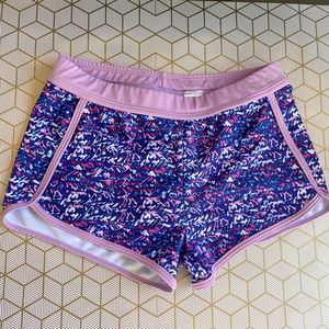 Purple printed swim shorts.